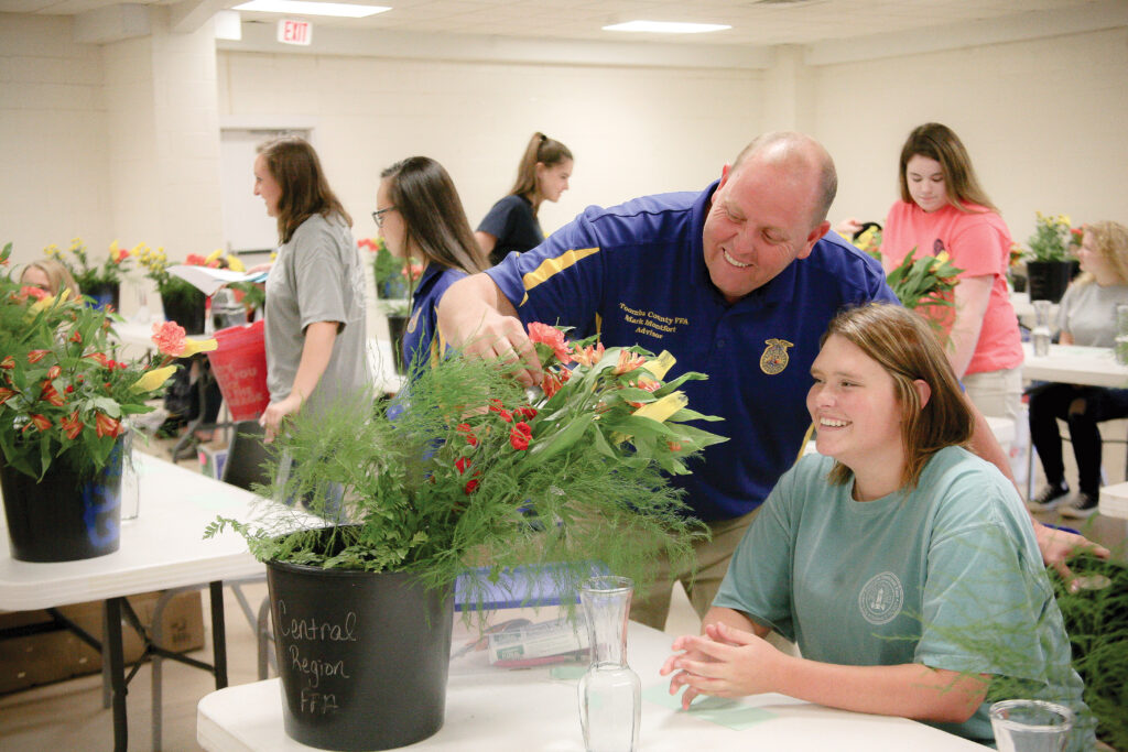 Participants attending a floral design workshop, captured through professional event photography for educational and community organizations