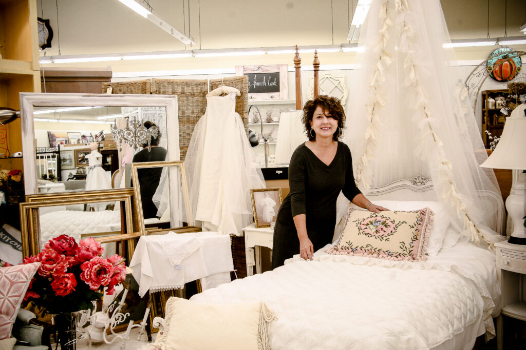 Retail business owner inside a boutique showroom, demonstrating professional brand photography for small businesses and entrepreneurs.